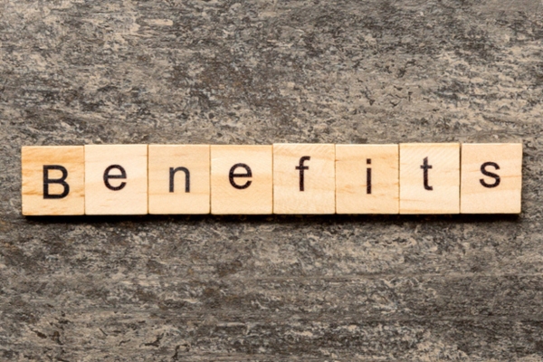 benefits spelled using wooden letter chips depicting professional HVAC contractor