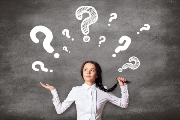 woman with question marks on top of her head depicting frequently asked questions