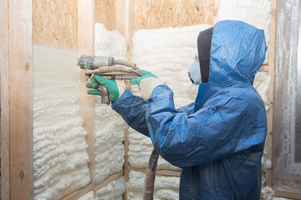 insulation contractor applying spray foam