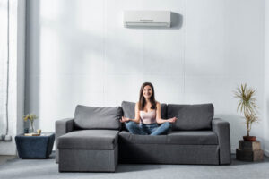 happy homeowner depicting air conditioner comfort