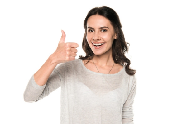 woman smiling and giving a thumbs up sign depicting advantages of choosing a fuel company