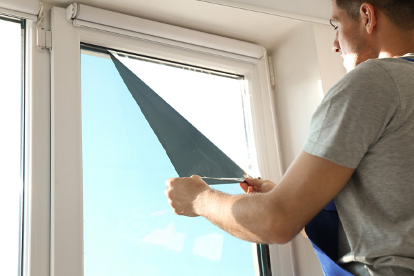 installing window film to block heat and enhance efficiency