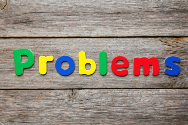 problems spelled using colorful letter magnets depicting common AC problems