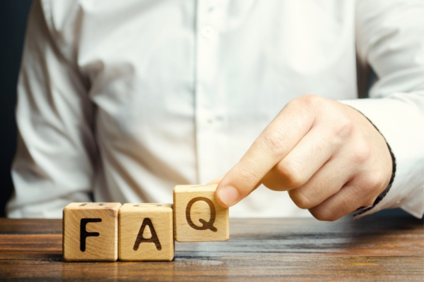 Man spelling FAQ using wooden blocks depicting home heating myth questions