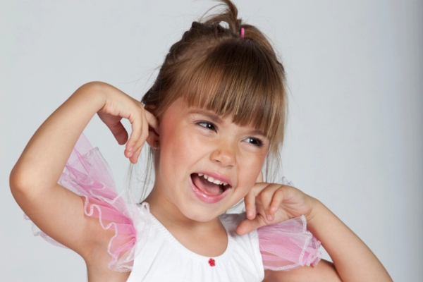 kid covering ear with fingers depicting HVAC blower noise