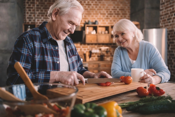 senior couple comfortably lounging in the kitchen depicting long-term power solutions