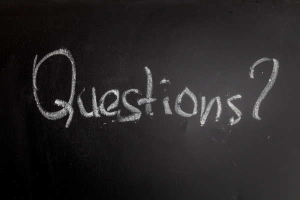 questions written on black chalkboard depicting hydronic heating FAQs