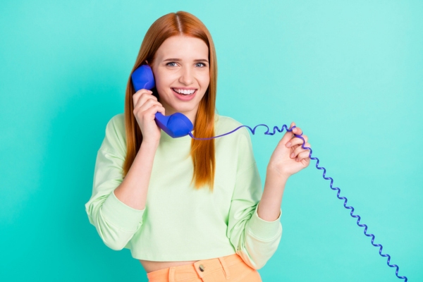 woman calling from home phone for oil delivery depicting will-call home heating oil delivery option