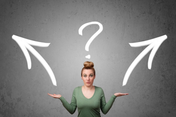 woman with both hands up showing arrows of different directions depicting Choosing An Energy-Efficient Heating System